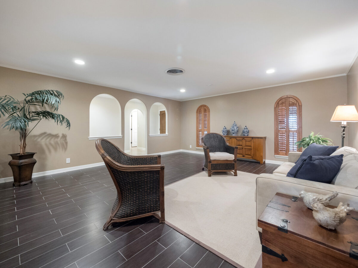 A living room with two chairs and a table