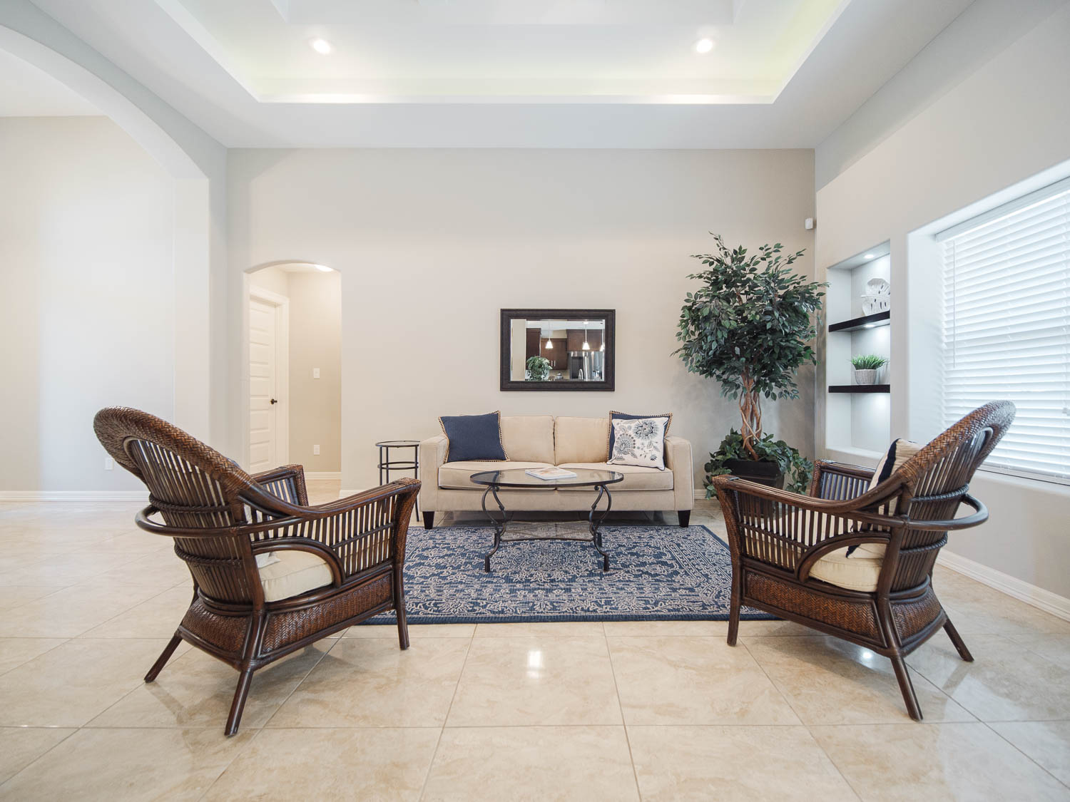 A living room with two chairs and a couch